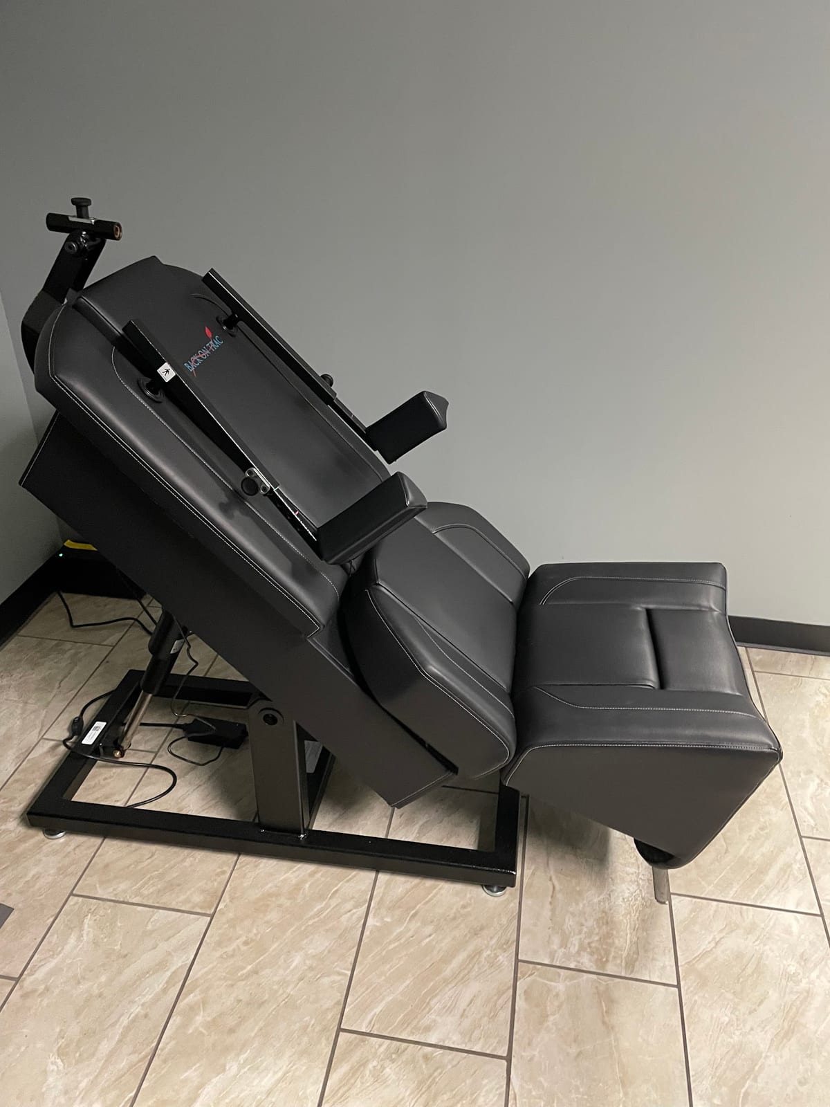 The seated, reclining treatment system
