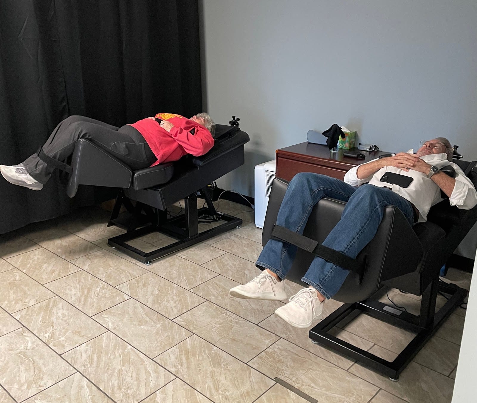 Two patients reclined in treatment chairs during a session